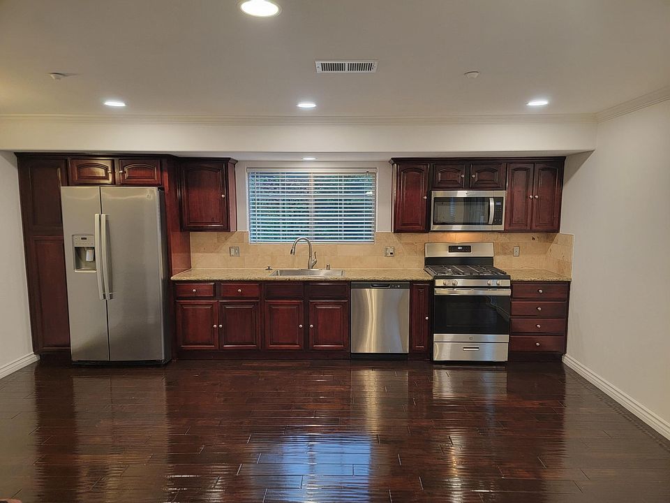 Custom dark cherry oak colored cabinets.