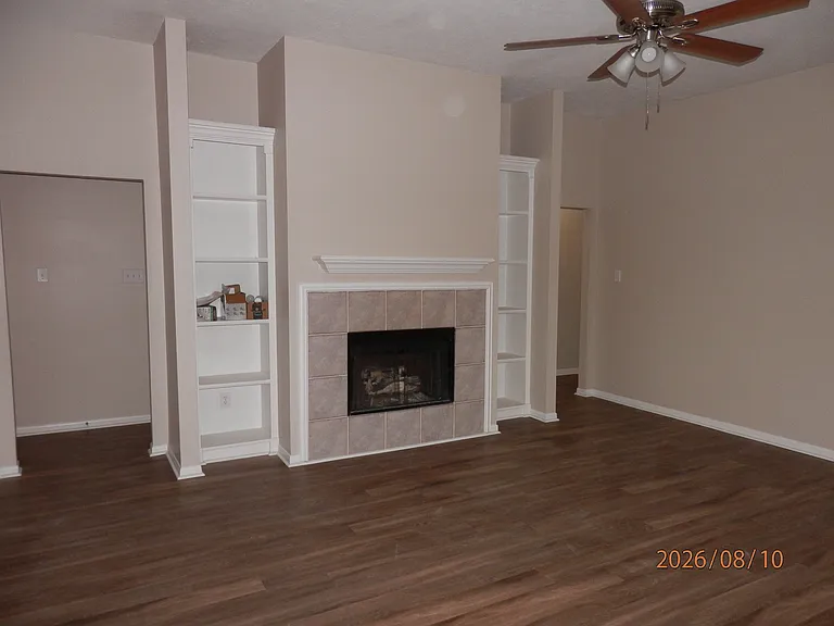 Family room has fireplace and built in shelving