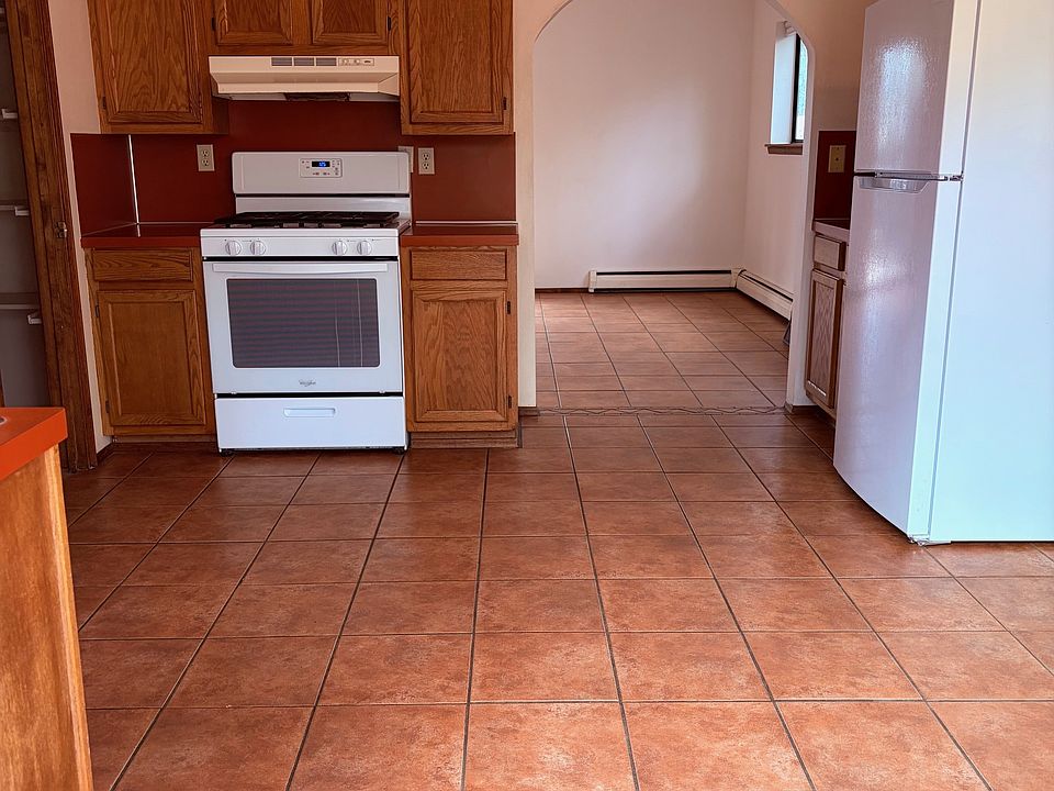 You enter into the kitchen of the apartment