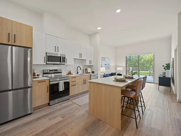 Kitchens feature large chef's island with built-in storage.