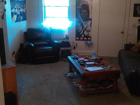 Nice sized living room wired for surround sound with a new air conditioner.