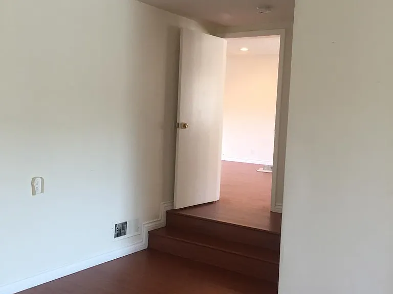 View from large bedroom into living toom