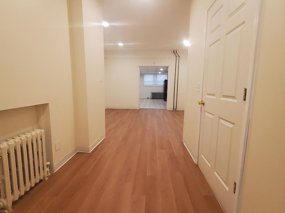 hallway leading to dining room with view of spacious kitchen