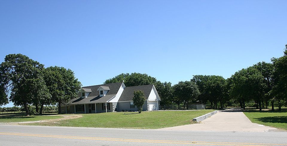 Home nestled in mature trees