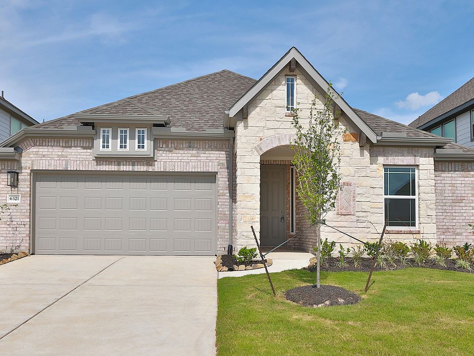 Experience refined architecture with stone facade, arched entry, and lush landscapes in Southern Poi