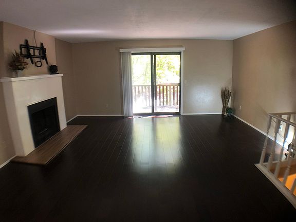 Remodeled Great room with fireplace, walkout to deck with view