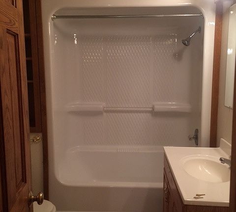 Bathroom with shower and tub unit