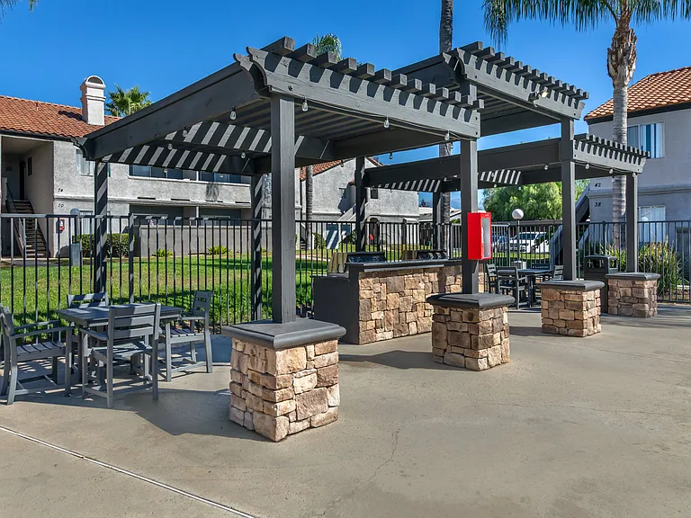 Sedona Apartments in Moreno Valley feature a renovated pool deck and resident gas grills, perfect for relaxing and outdoor cooking.