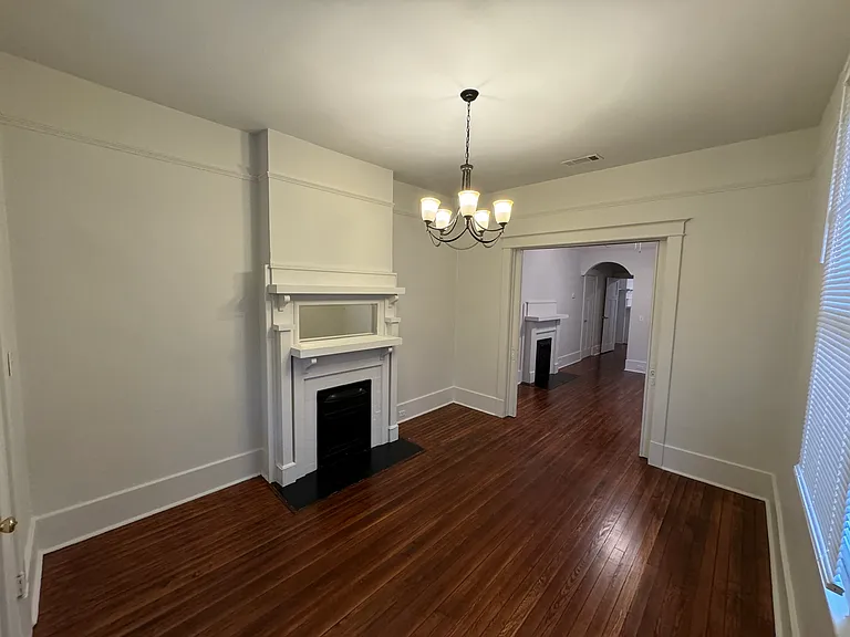 Front parlor open onto second parlor which can be used for an office or a 2nd bedroom. The rooms are separated by pocket doors