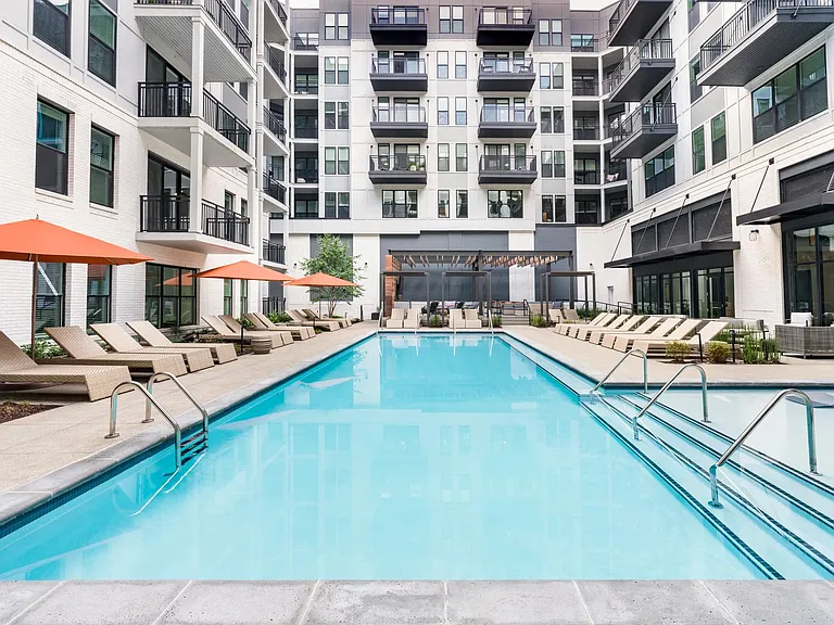 Take a break by the sparkling resort-style pool, complete with lounge seating, shade umbrellas, and space to relax or recharge.