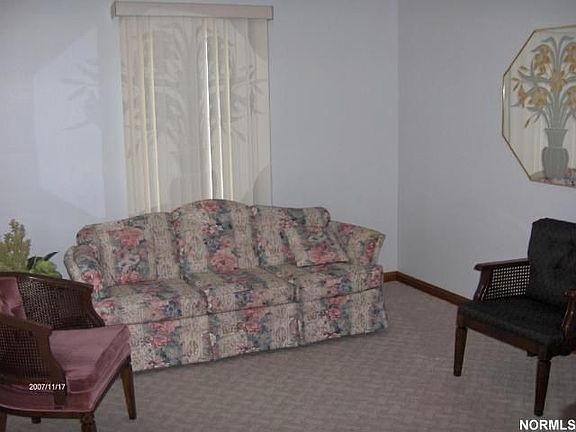 Nice size living room to relax in notice the molding!