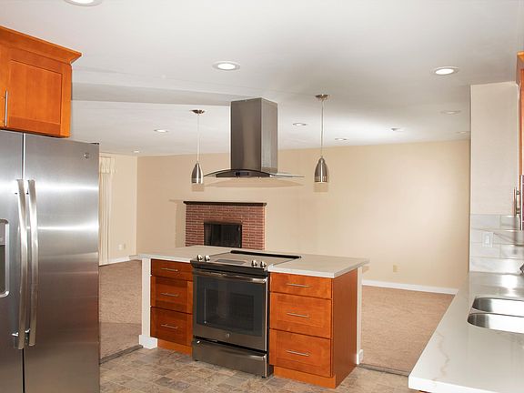 Large open kitchen, with stainless steal appliances and island seating