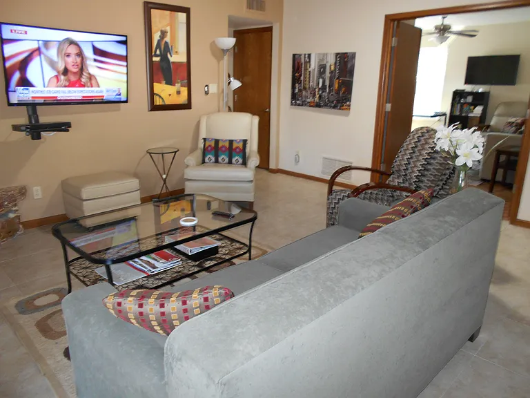 Open Plan Great Room Private Den/Ofc in background w/double doors