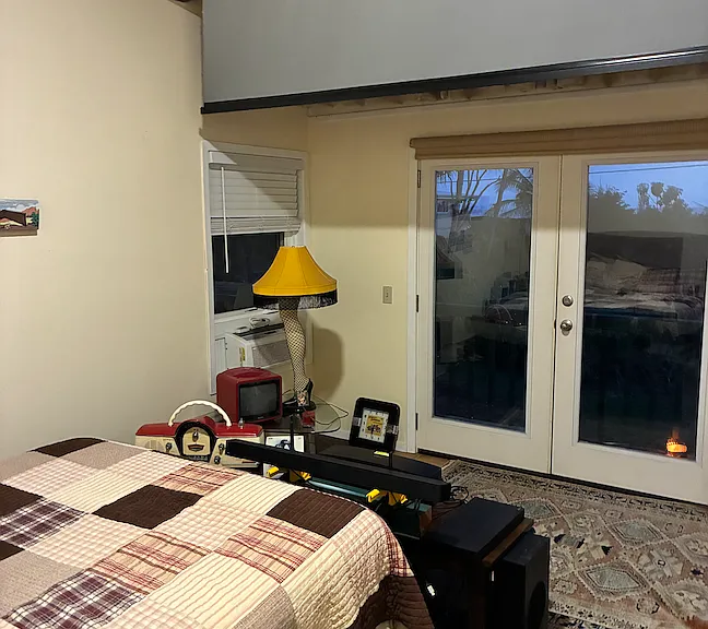 Master Bedroom Queen Bed French Doors with magnetic screen retractable 4k projection system Christmas Story Memorabilia
