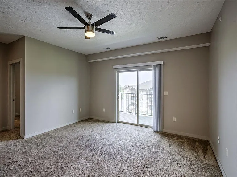 Modern ceiling fan in living room at Avenue 204.