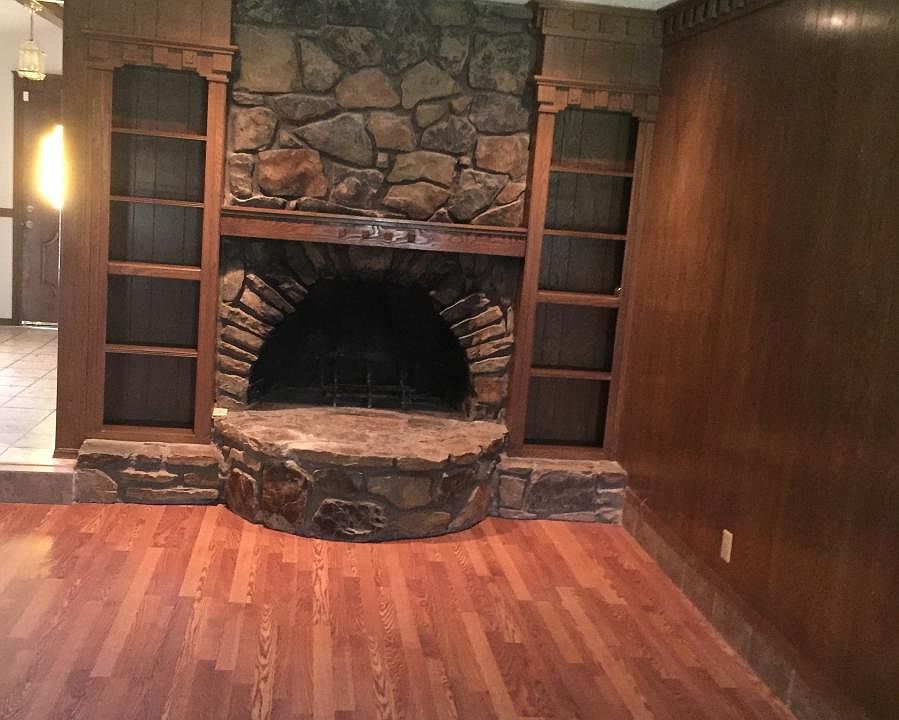 Stone Fireplace in Paneled Living Area