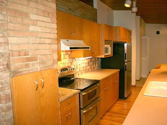 Kitchen dual oven, stainless steel appliances.