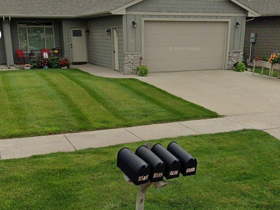 Covered patio in front, 2 car garage and well maintained lawn in front and back.