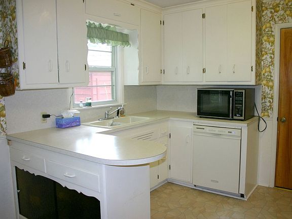 The kitchen has great workspace and an updated dishwasher and range.