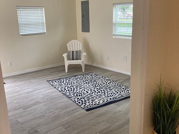 Living room with luxury vinyl tile. It's huge. Bring your large sectional couch and big screen TV...Super Bowl is just around the corner!