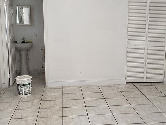 Master bedroom with bathroom and walk-in closet 