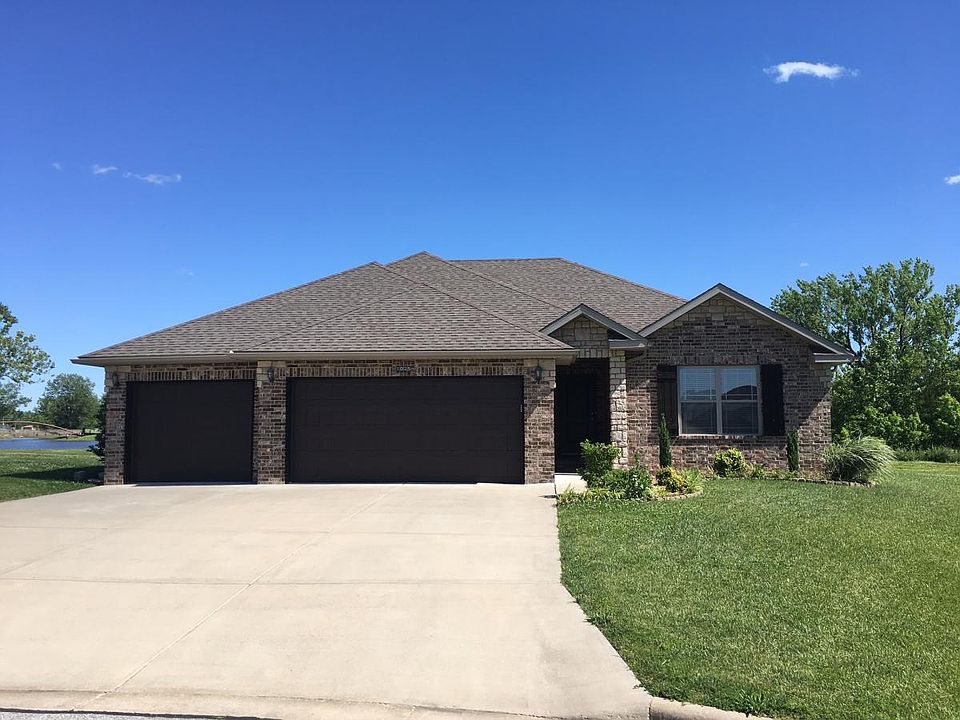 View of Front of House w/ Lake in Background