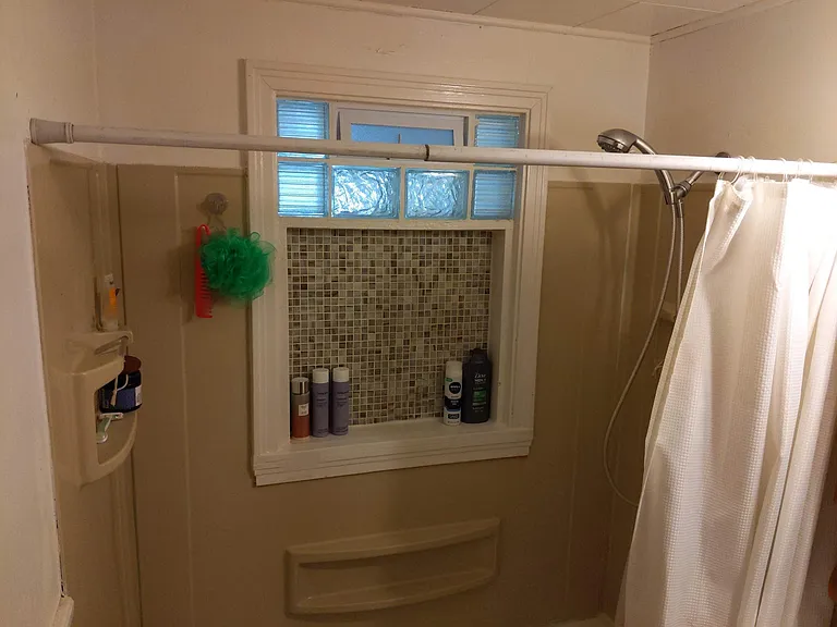 Combination tub/shower in the lower level full bathroom....Updated.