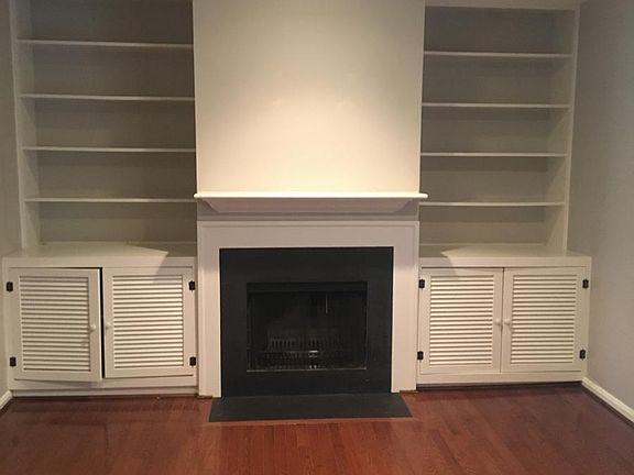 living room with fireplace and built ins