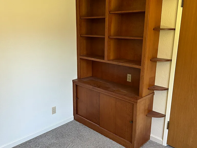 Built-ins in bedroom #3 with a view to the rear yard.