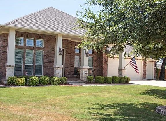 Welcoming brick front porch...perfect for sipping sweet tea in the afternoon!