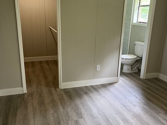 Master bedroom with large closet and beautifully renovated bathroom
