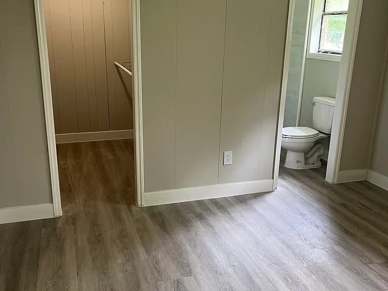 Master bedroom with large closet and beautifully renovated bathroom