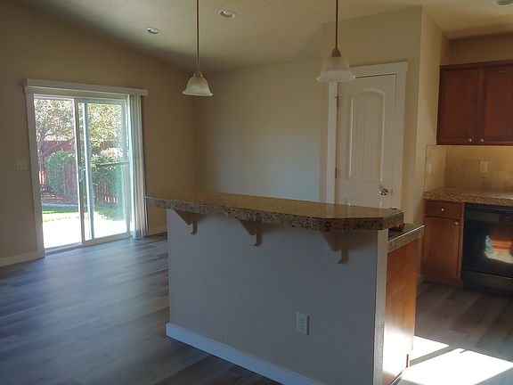 Kitchen with granite counter tops & new LVP