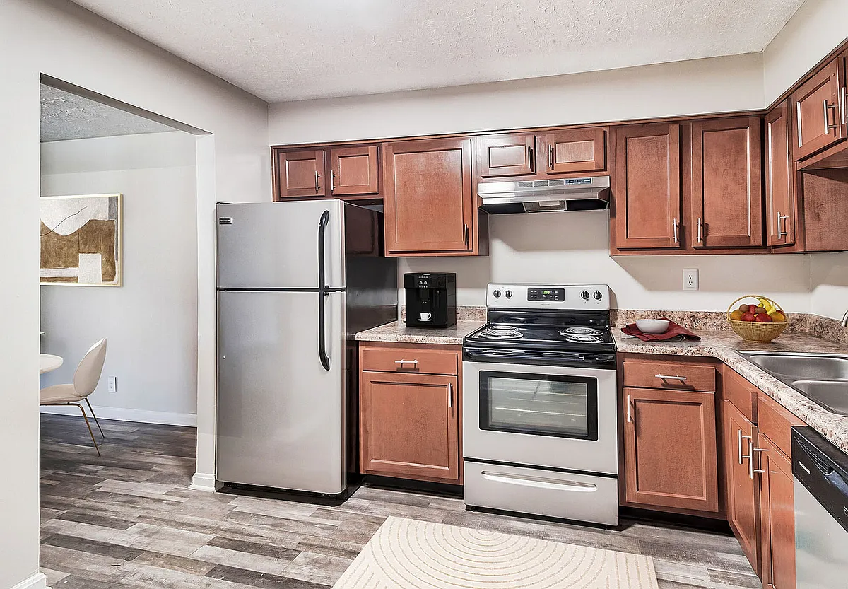 Kitchen with stainless appliance package, modern cabinetry, & hardwood style flooring - Vetra Hurstbourne