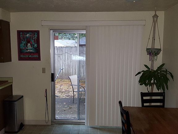 View from living into the backyard (Note: furnishings belong to a prior tenant; unit will be rented unfurnished)