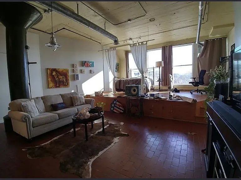 Condo Living Area w. a view to Bedroom