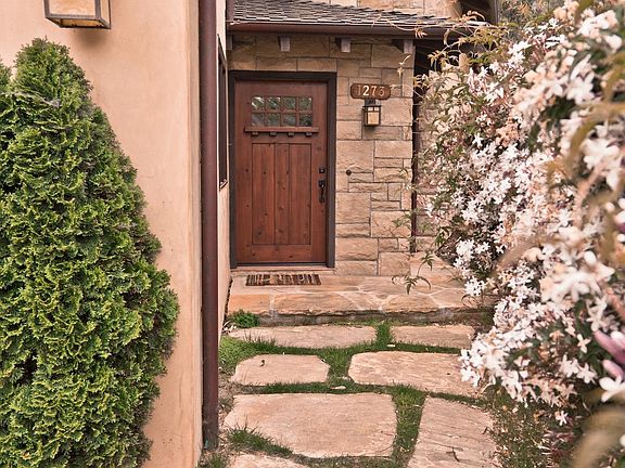 Front entryway with star jasmine in bloom (February)