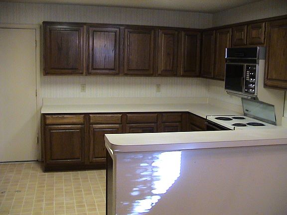 Spacious Kitchen Opens To Breakfast Room Overlooking Patio !