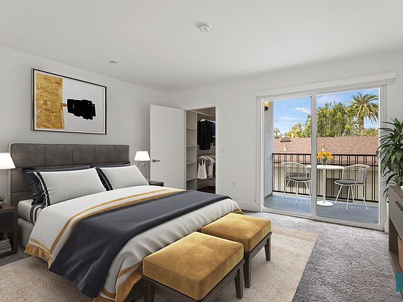 Bedroom with Closet and Patio Access