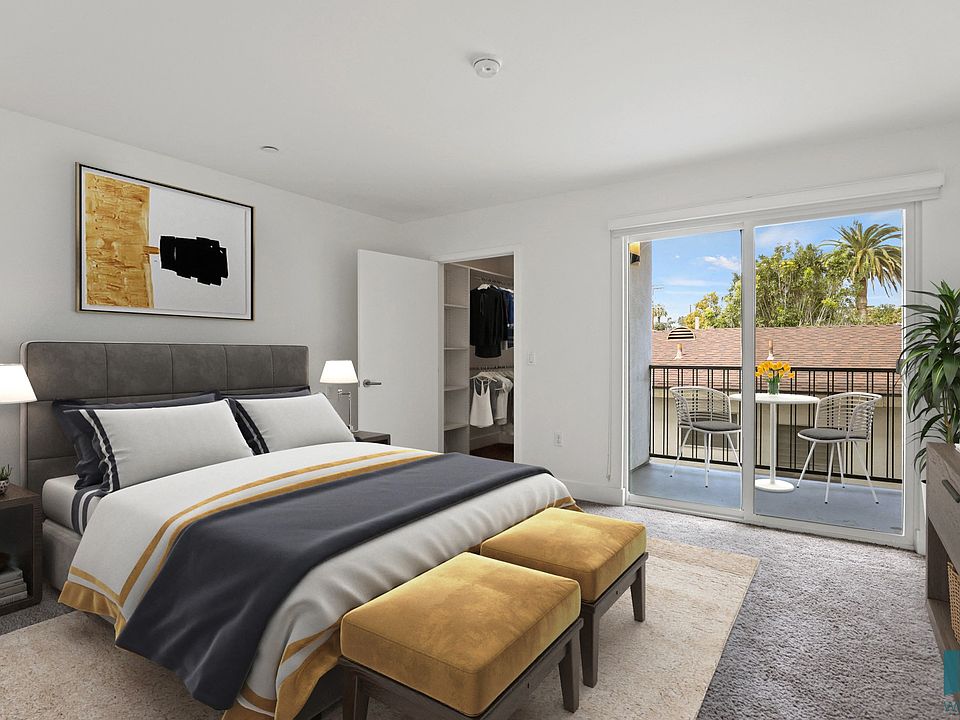 Bedroom with Closet and Patio Access