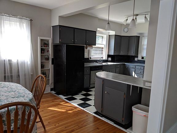 Updated kitchen with stainless appliances, dishwasher, garbage disposer and LOTS of custom cabinets!