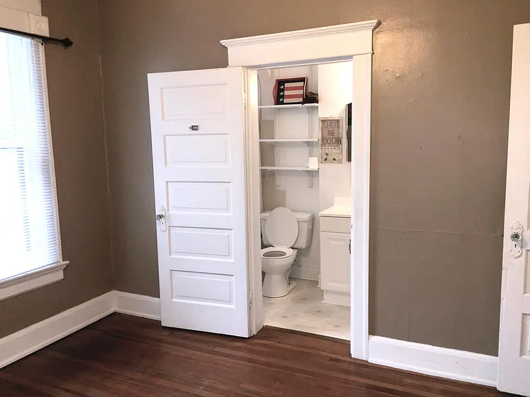Bedroom looking at bathroom door
