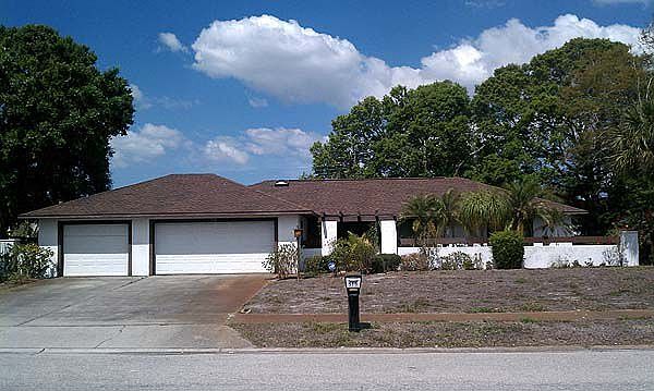 Three car garage, split plan with pool