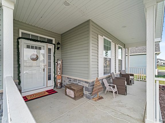 This porch is so cute and you will enjoy decorating as the seasons change.