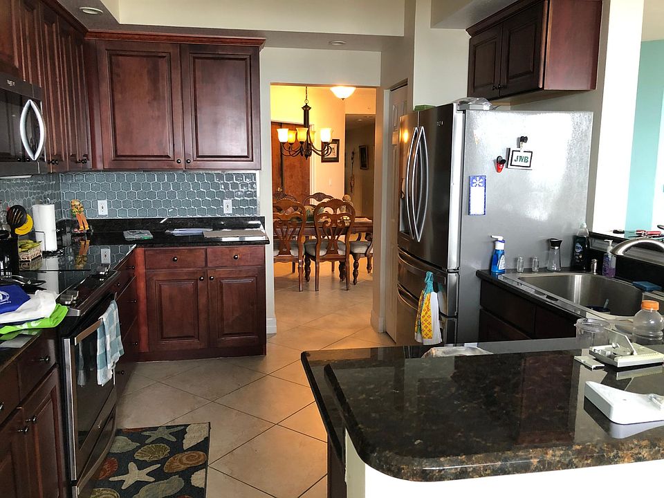 Kitchen with stainless steel appliances.