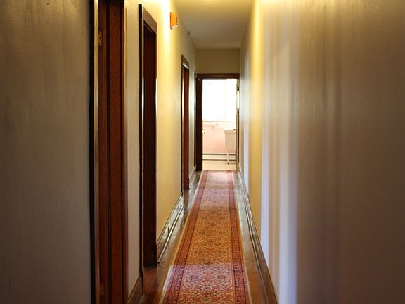 hallway from front parlor to bath/kitchen