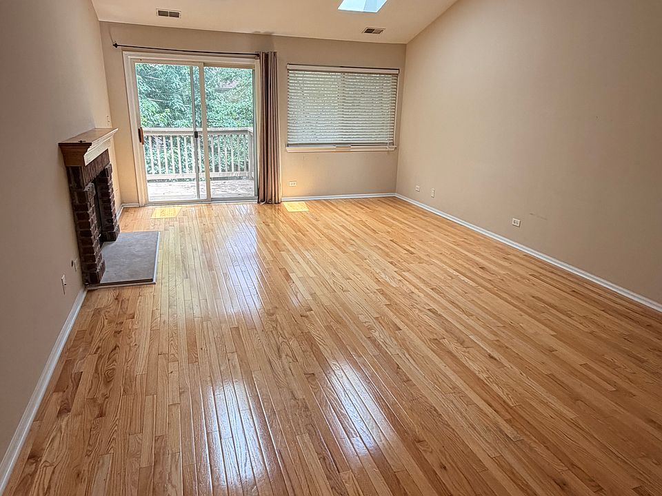 Living room with skylights and balcony