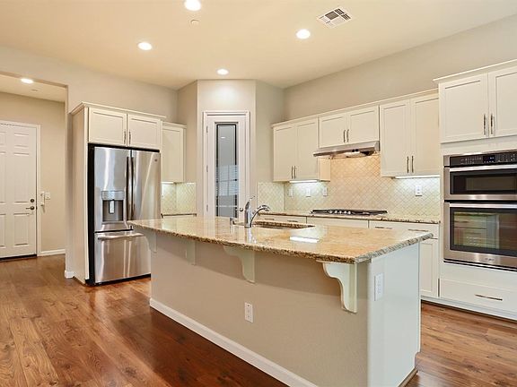 Upgraded granite counters and custom backsplash with breakfast bar. Refrigerator is included!
