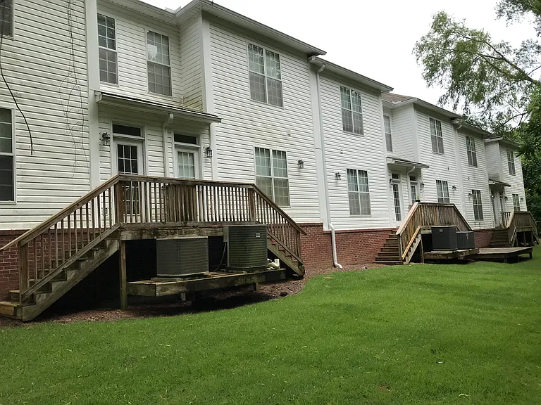 Back yard. Middle unit is 223 Evans.