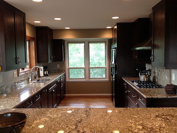 AMAZING gourmet kitchen with custom cherry cabinets and wide plank wood floors